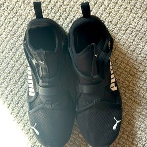 Black and white running pumas